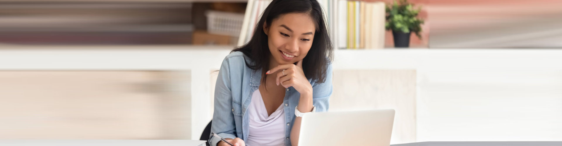 a young lady using a laptop